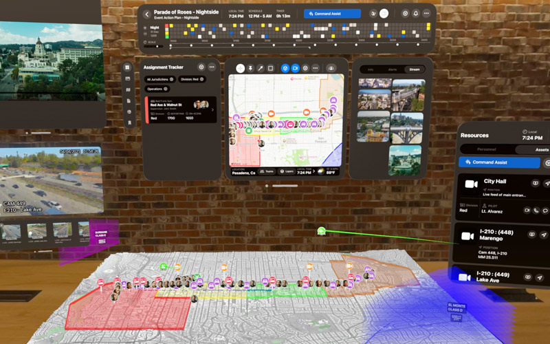 AR interface showing a parade route map, assignment tracker, live camera feeds, and resource management tools projected over a 3D city model